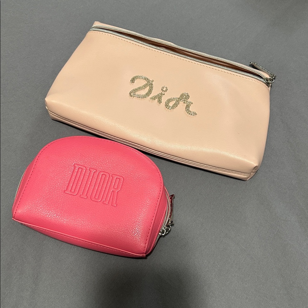 Light and dark pink Dior pouches.